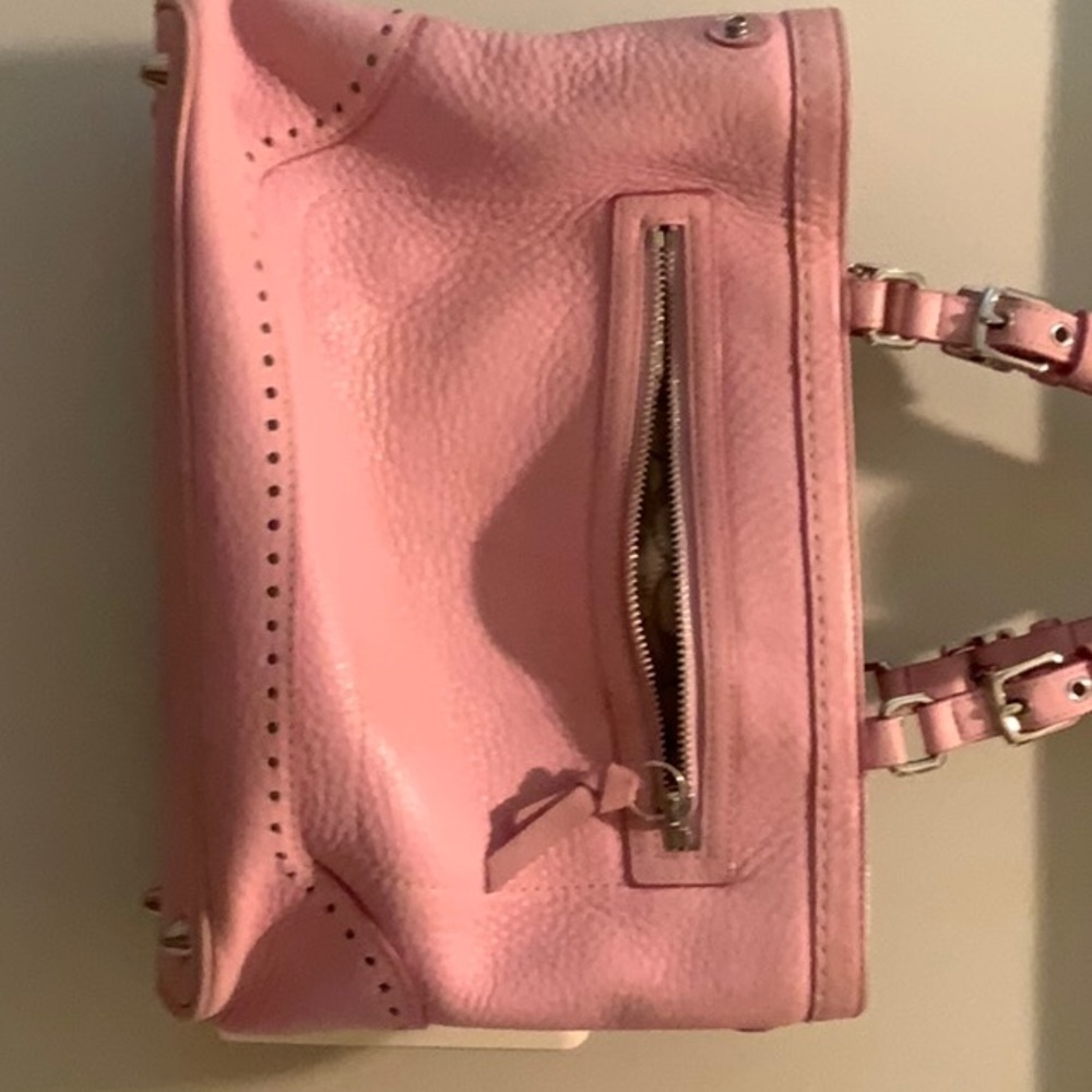 SOLD!
Pink vintage coach love these pockets for your cell phone